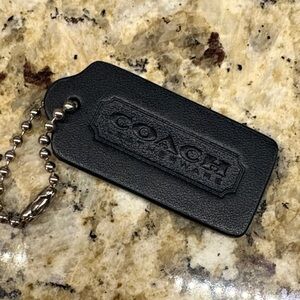 Coach black leather tag